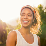 Portrait,Of,Beautiful,African,American,Woman,Smiling,And,Looking,Away